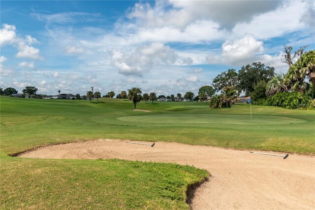 2260 NW 51st Ter, Ocala, FL 34482 - view of property's community featuring view of golf course, a yard, and a putting area