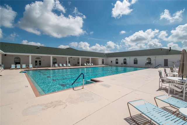 view of swimming pool with a patio