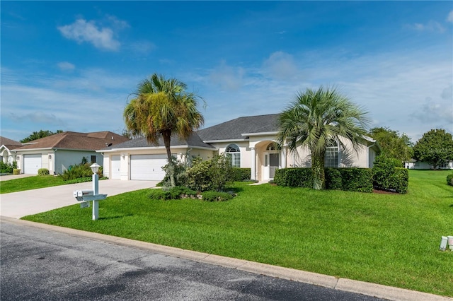 ranch-style house featuring a garage and a front yard