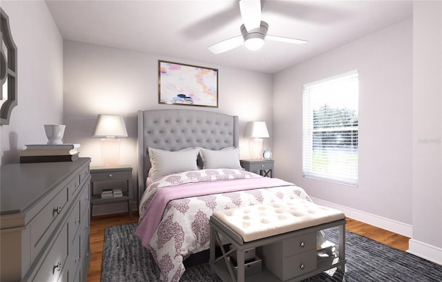 bedroom with dark hardwood / wood-style flooring and ceiling fan