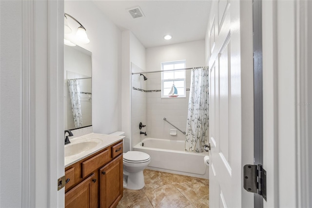 full bathroom featuring shower / bath combination with curtain, vanity, and toilet