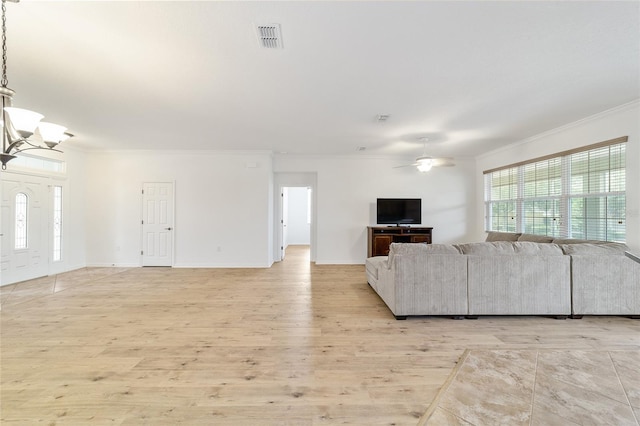 unfurnished living room featuring crown molding, ceiling fan with notable chandelier, and light hardwood / wood-style flooring