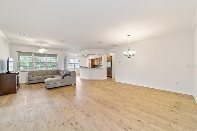 unfurnished living room with crown molding, ceiling fan with notable chandelier, and light wood-type flooring