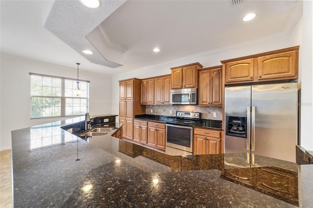 kitchen with sink, decorative light fixtures, ornamental molding, appliances with stainless steel finishes, and backsplash