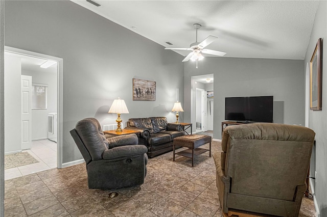 tiled living room with lofted ceiling and ceiling fan