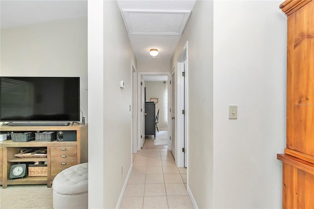 hall featuring light tile patterned flooring