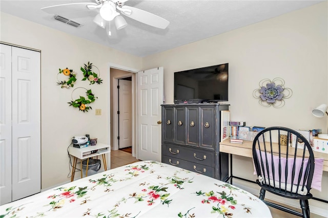 bedroom featuring a closet and ceiling fan