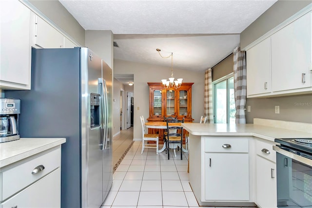 kitchen featuring white cabinetry, light tile patterned floors, and hanging light fixtures