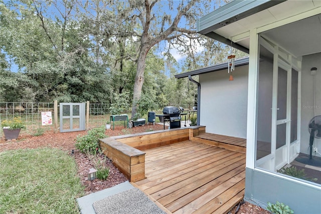 wooden deck with grilling area