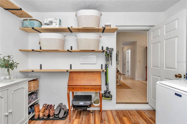 kitchen featuring light wood-type flooring and refrigerator