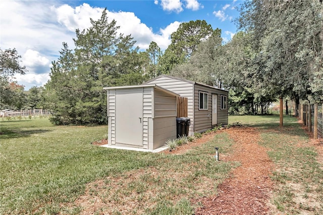 view of outbuilding featuring a yard