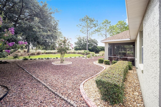 view of yard with a sunroom