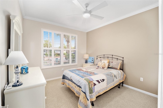 carpeted bedroom featuring ceiling fan and ornamental molding