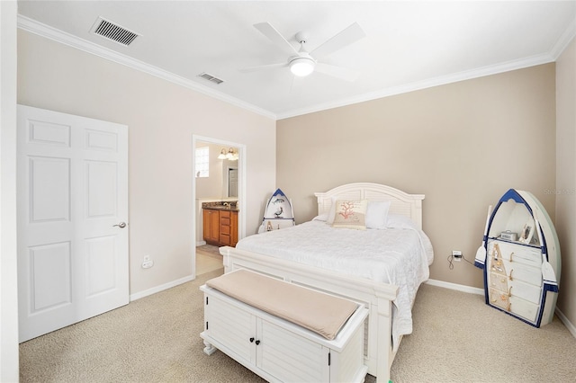 bedroom with ceiling fan, crown molding, light carpet, and ensuite bath