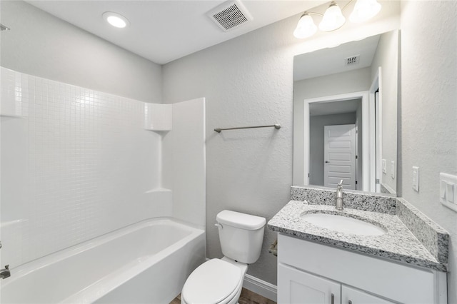 full bathroom with vanity, toilet, and  shower combination