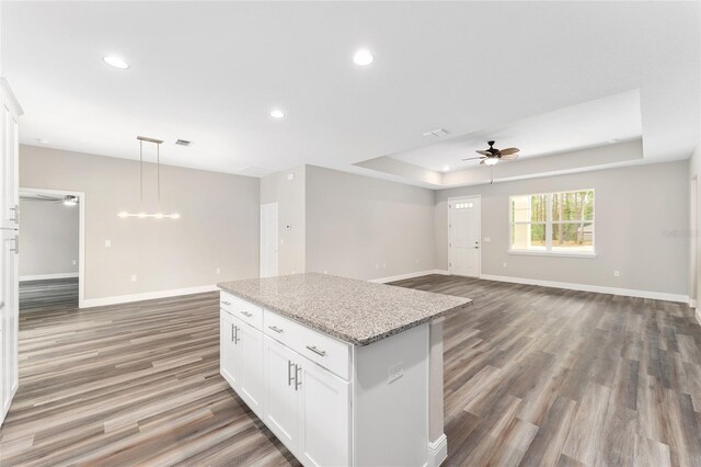 4444 SW 118th Ter, Ocala, FL 34481 - kitchen with a ceiling fan, open floor plan, baseboards, a center island, and wood finished floors