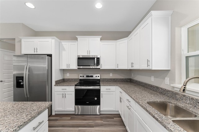 4444 SW 118th Ter, Ocala, FL 34481 - kitchen featuring stainless steel appliances, a sink, white cabinetry, recessed lighting, and dark wood-style floors