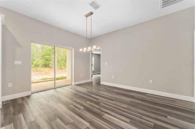 4444 SW 118th Ter, Ocala, FL 34481 - unfurnished room featuring baseboards, dark wood finished floors, and a chandelier