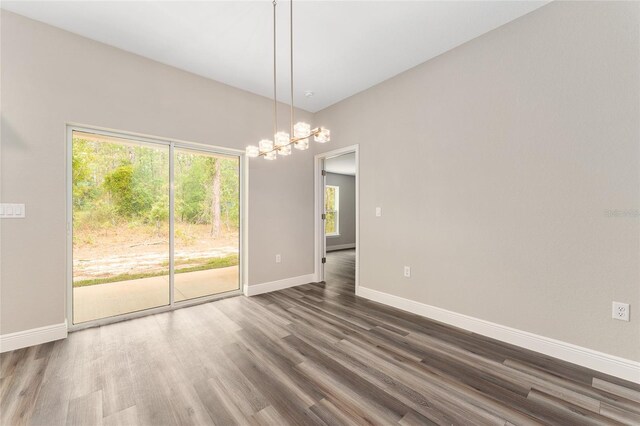 4444 SW 118th Ter, Ocala, FL 34481 - unfurnished dining area featuring plenty of natural light, dark wood finished floors, and baseboards