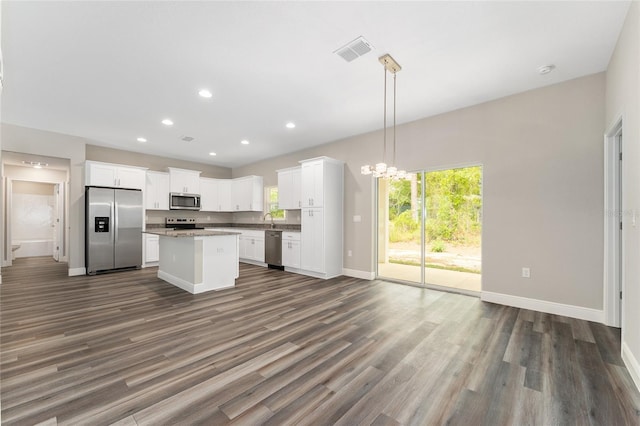 4444 SW 118th Ter, Ocala, FL 34481 - kitchen with appliances with stainless steel finishes, open floor plan, baseboards, a center island, and dark wood-style flooring