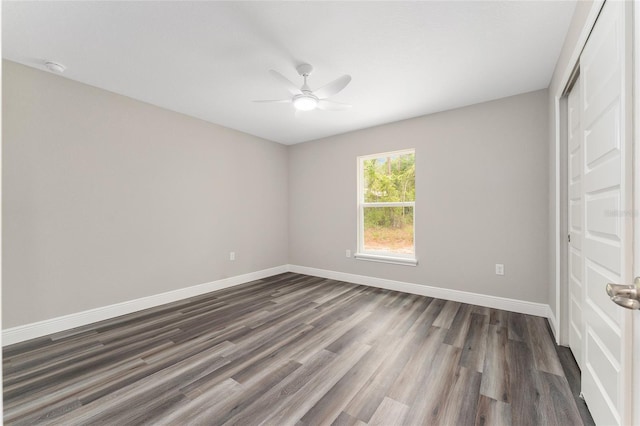 4444 SW 118th Ter, Ocala, FL 34481 - unfurnished bedroom with dark wood finished floors, baseboards, ceiling fan, and a closet