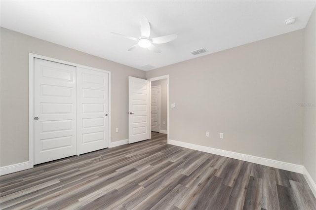 4444 SW 118th Ter, Ocala, FL 34481 - unfurnished bedroom with baseboards, wood finished floors, a closet, and ceiling fan