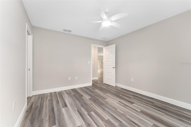 4444 SW 118th Ter, Ocala, FL 34481 - unfurnished bedroom with wood finished floors, baseboards, and a ceiling fan