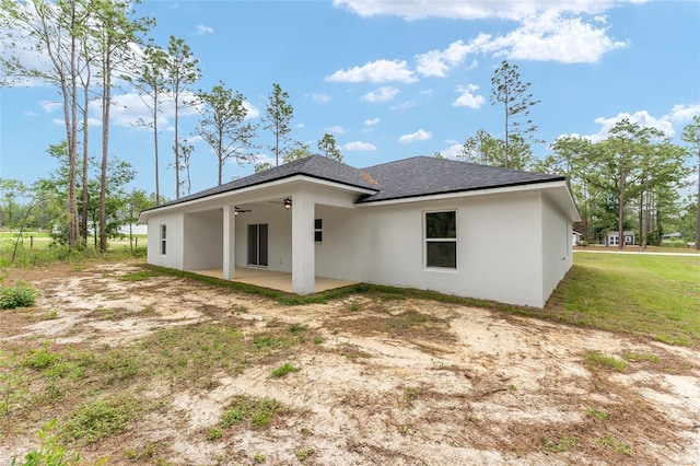 4444 SW 118th Ter, Ocala, FL 34481 - back of house with a patio area, a shingled roof, stucco siding, and a ceiling fan