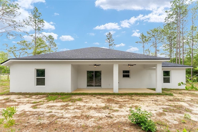 4444 SW 118th Ter, Ocala, FL 34481 - back of house with ceiling fan, roof with shingles, stucco siding, and a patio