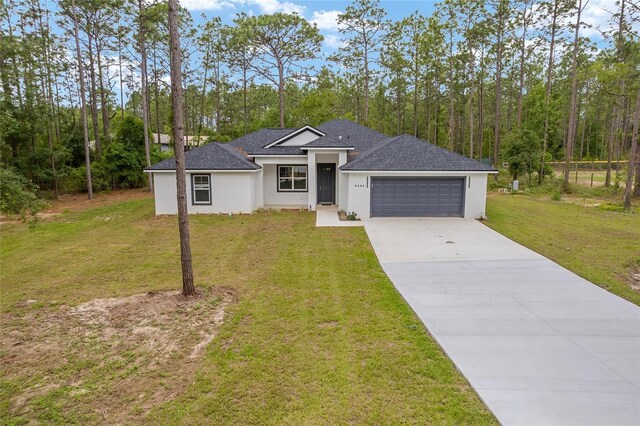 4444 SW 118th Ter, Ocala, FL 34481 - view of front of property with driveway, a garage, a front yard, and stucco siding