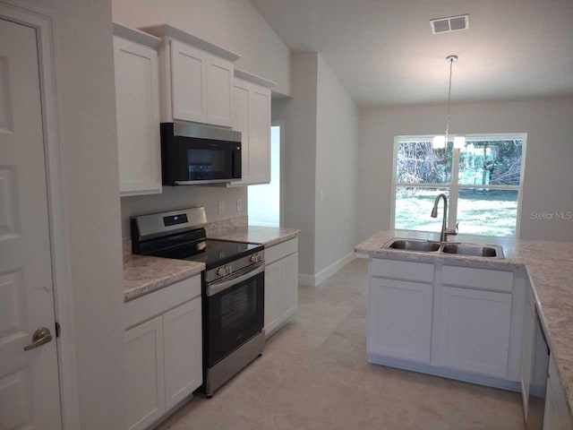 kitchen featuring sink, an inviting chandelier, stainless steel appliances, and white cabinetry