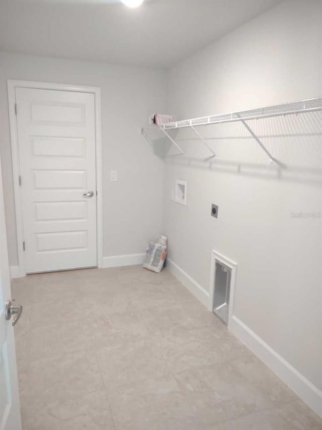 laundry area with hookup for a washing machine and hookup for an electric dryer