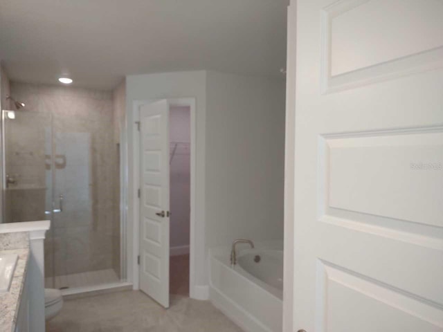 full bathroom with plus walk in shower, toilet, tile patterned floors, and vanity