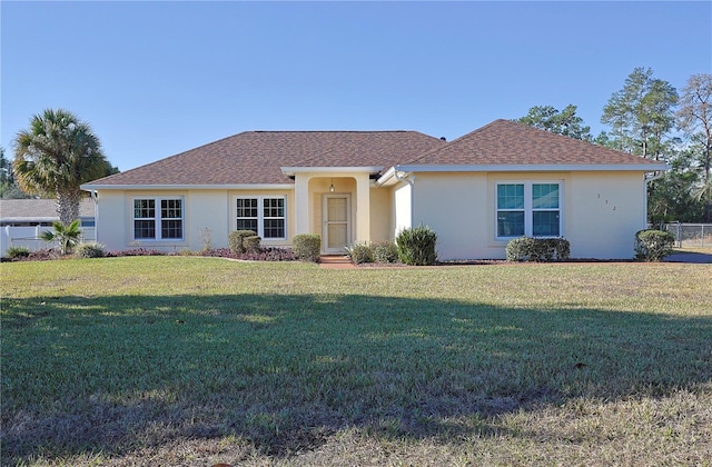 single story home with a front yard