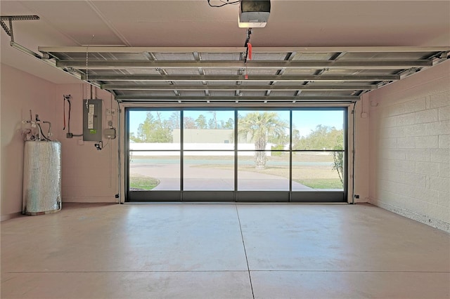 garage with a garage door opener, electric panel, and water heater