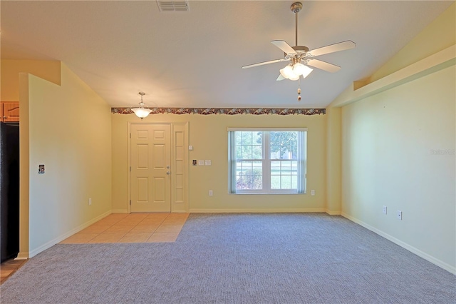 interior space featuring ceiling fan and vaulted ceiling