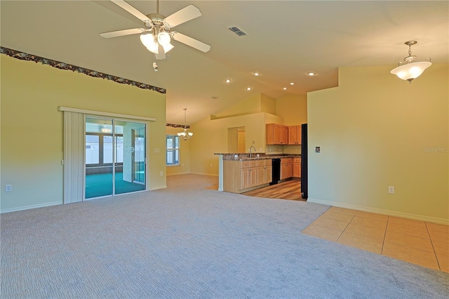 unfurnished living room with high vaulted ceiling, sink, light carpet, and ceiling fan