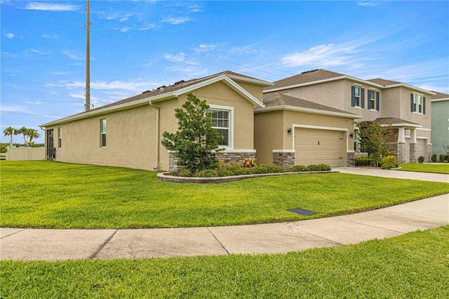 view of front of house with a garage and a front yard