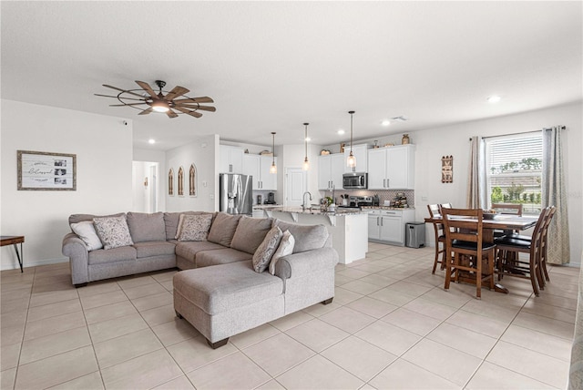 tiled living room featuring ceiling fan