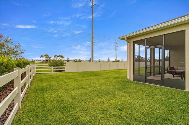 view of yard featuring a sunroom