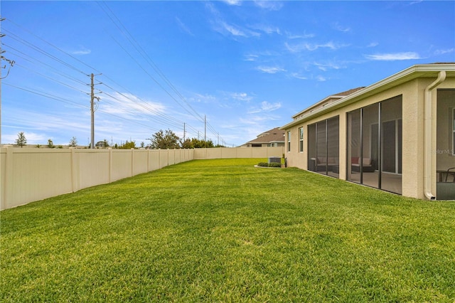 view of yard with a sunroom