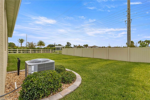 view of yard featuring central air condition unit