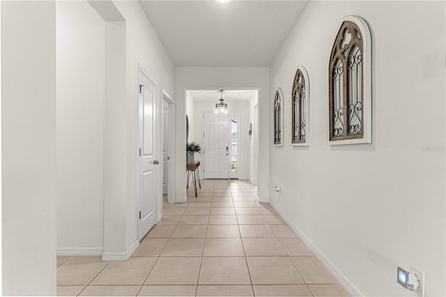 hallway with light tile patterned floors