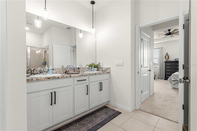 bathroom featuring tile patterned floors, vanity, walk in shower, and ceiling fan