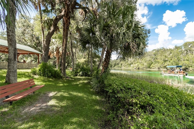 view of yard with a gazebo and a water view