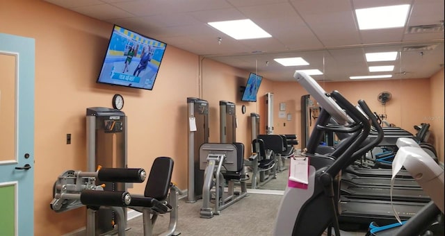 gym featuring a paneled ceiling