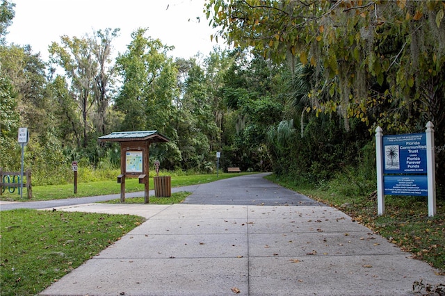 view of home's community featuring a lawn