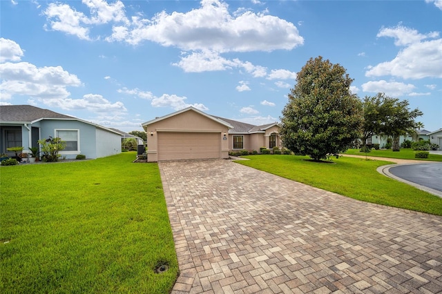 single story home featuring a garage and a front yard