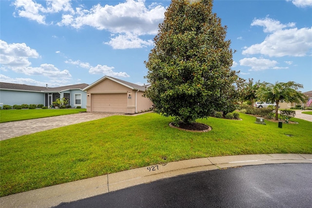 view of front of property with a garage and a front yard