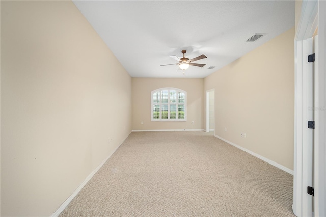 unfurnished room featuring carpet and ceiling fan